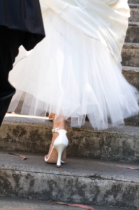 Bride climbing steps